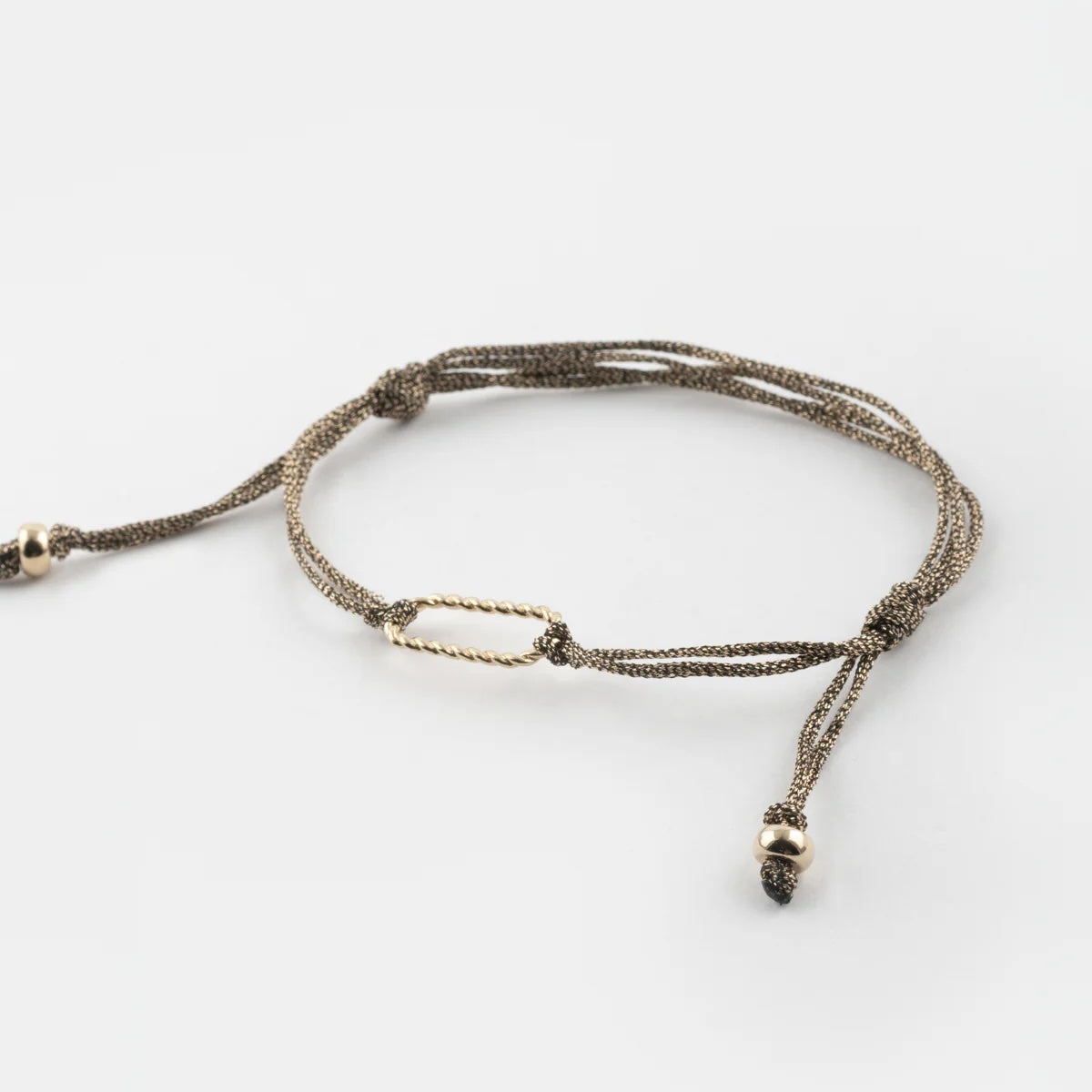 Bracelet with textured cord on a white background