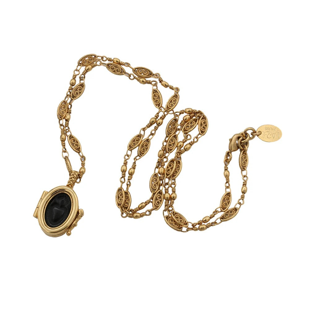 Gold necklace with a pendant on a white background