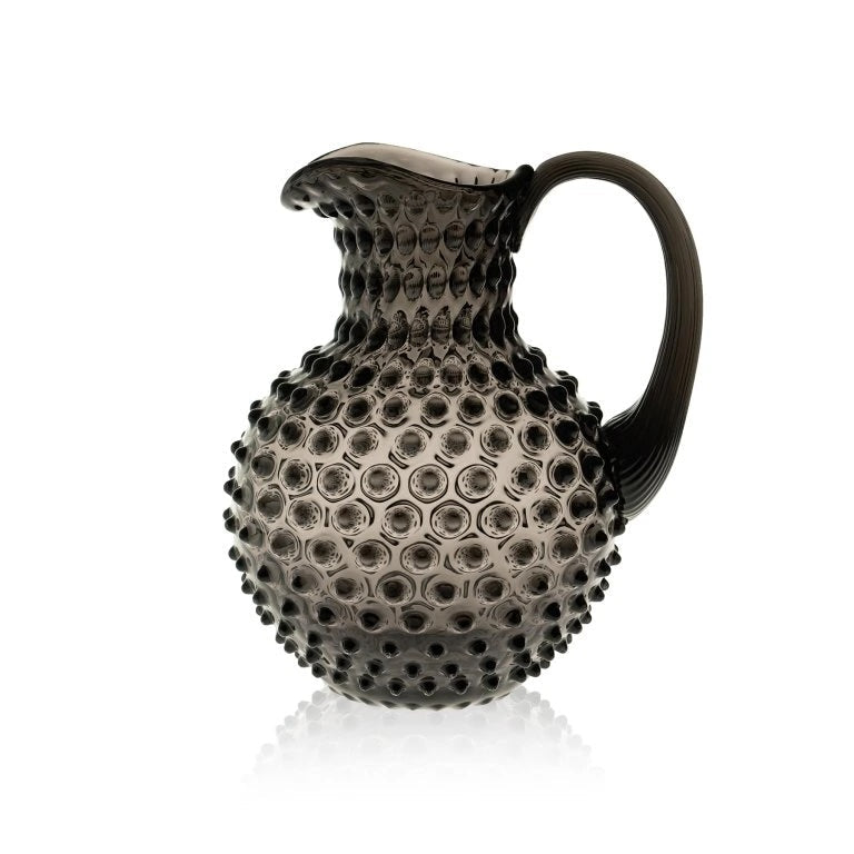 Black Smoke Decorative pitcher with textured surface on a white background