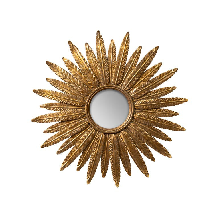 Decorative gold sunburst mirror on a white background