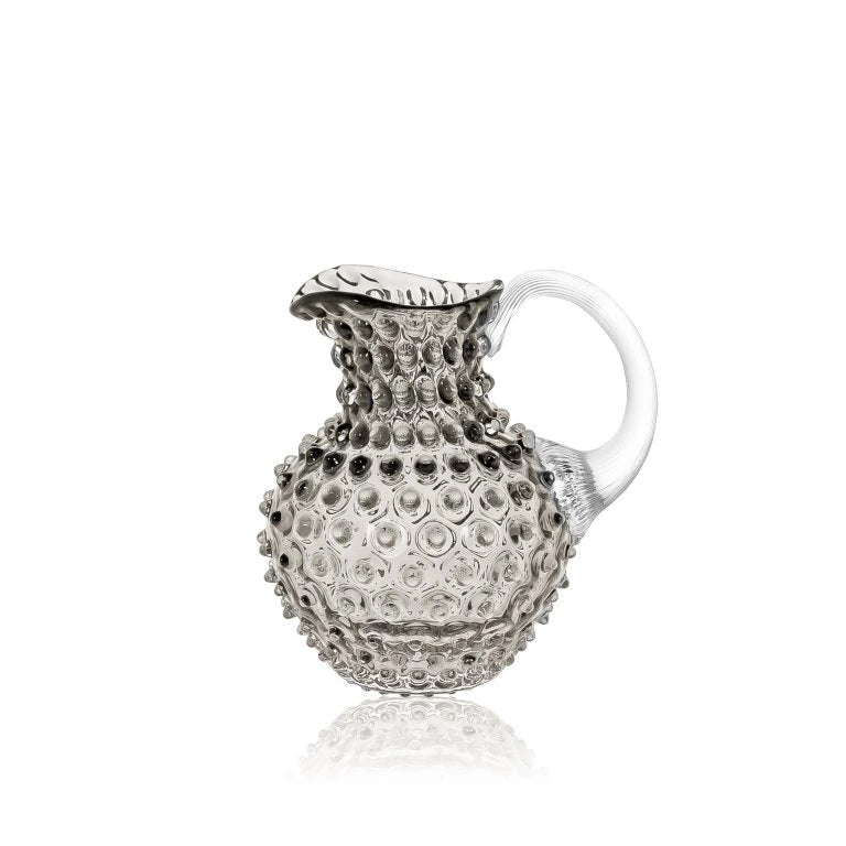 Black smoke ombre textured glass pitcher on a white background