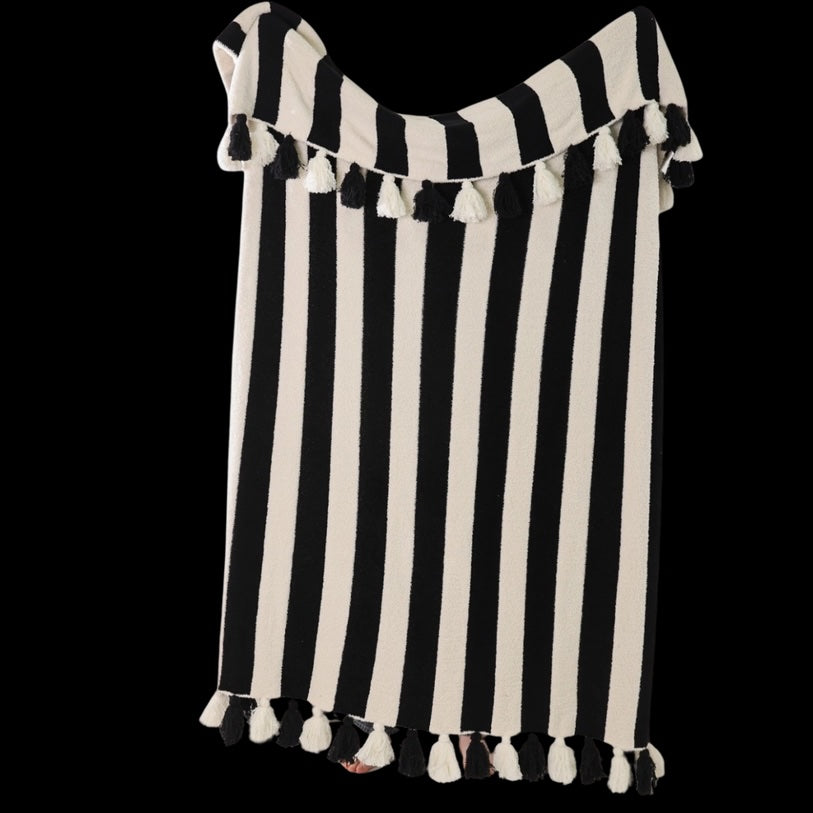 Black and white striped off-shoulder top with tassels on a transparent background
