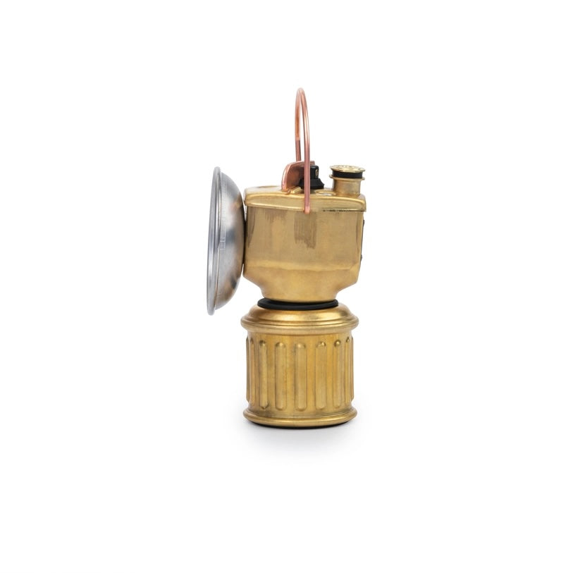 Brass lamp with a white background