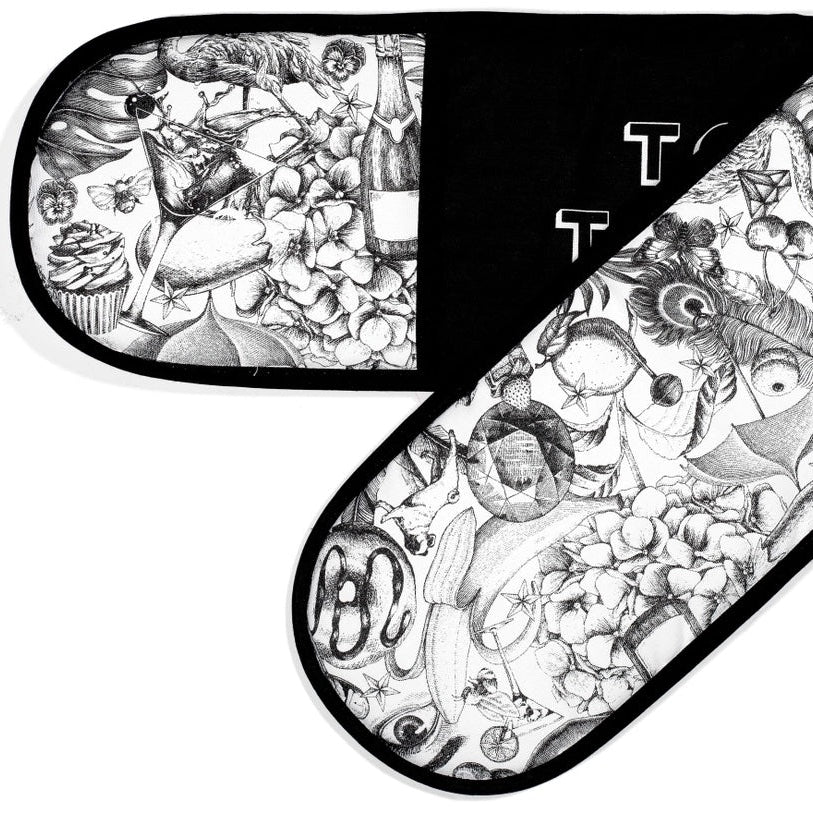 Black and white patterned oven mitt with artistic design on a white background