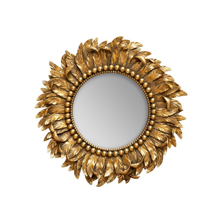 Decorative gold mirror with feather-like design on a white background