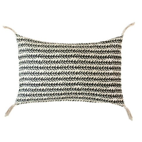 Black and white thorn pattern cushion with tassels on a white background