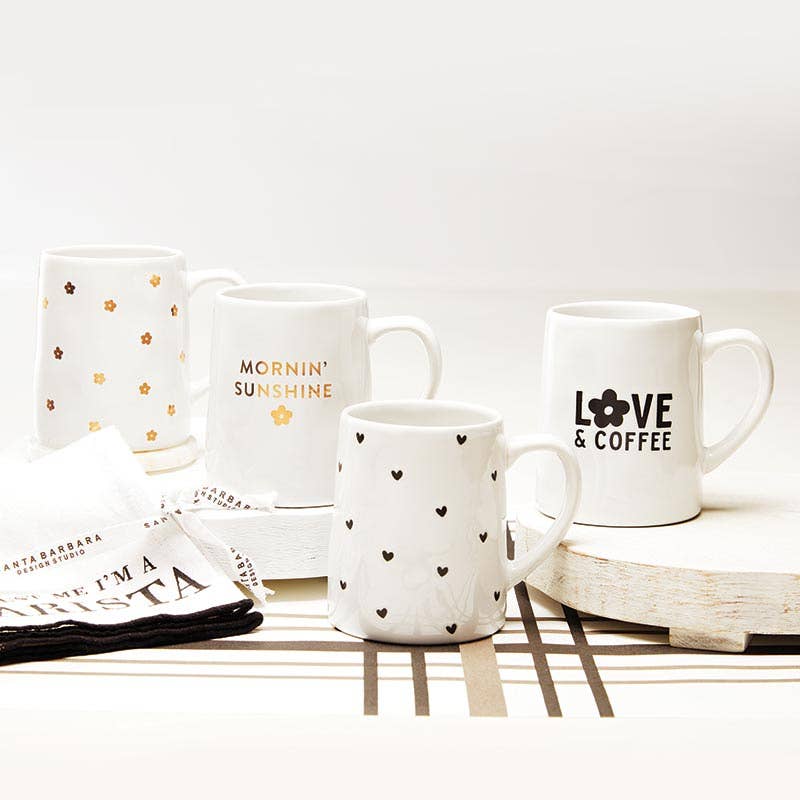 Organic tapered ceramic mug shown from another angle with its heart-debossed detail – Santa Barbara Design Studio