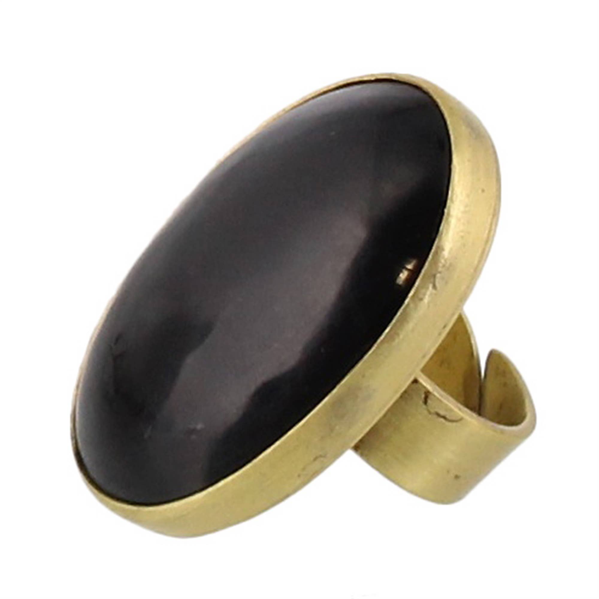 A wide, chunky ring featuring a large, smooth, oval black stone set in a thick, polished gold-tone metal band, shown against a plain white background.