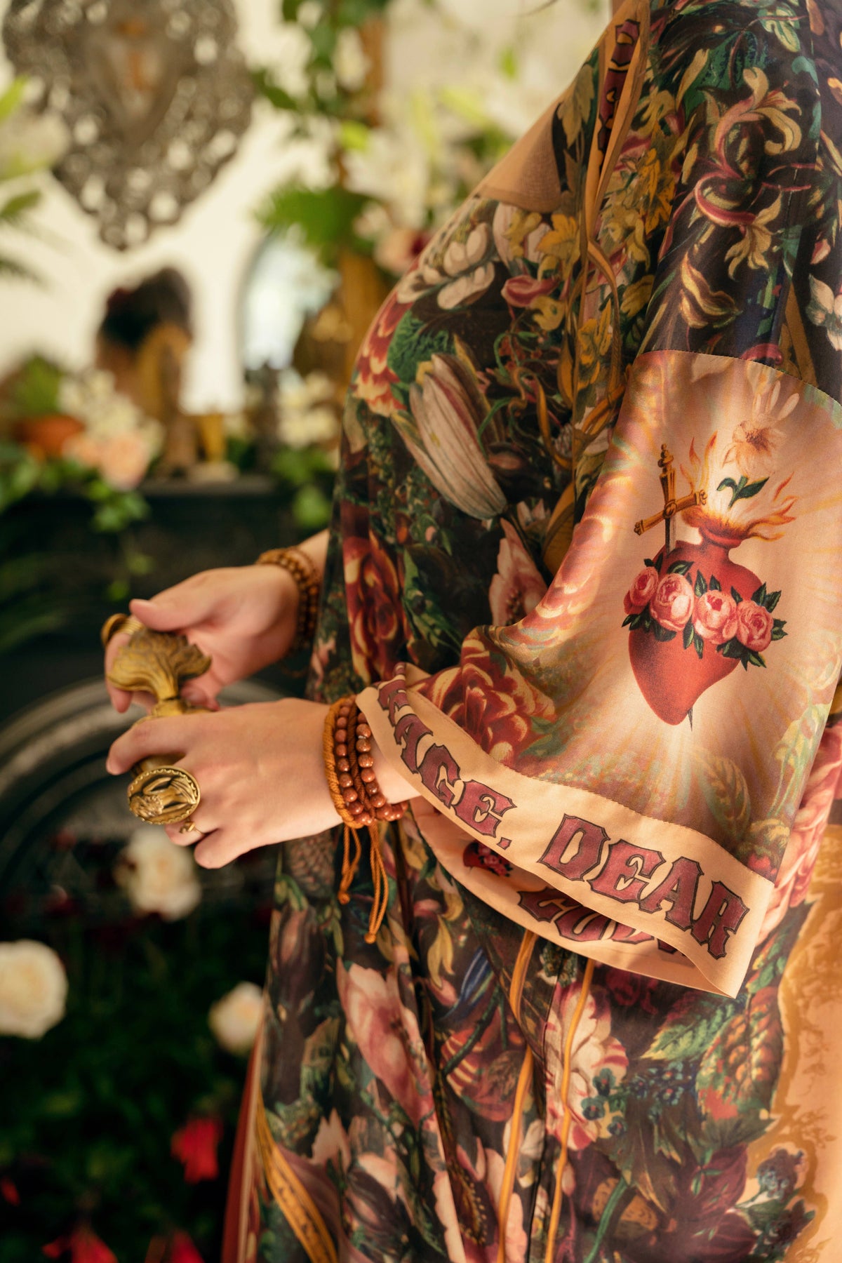 Close-up of the kimono sleeve with a flaming sacred heart and lettered cuff – Market of Stars