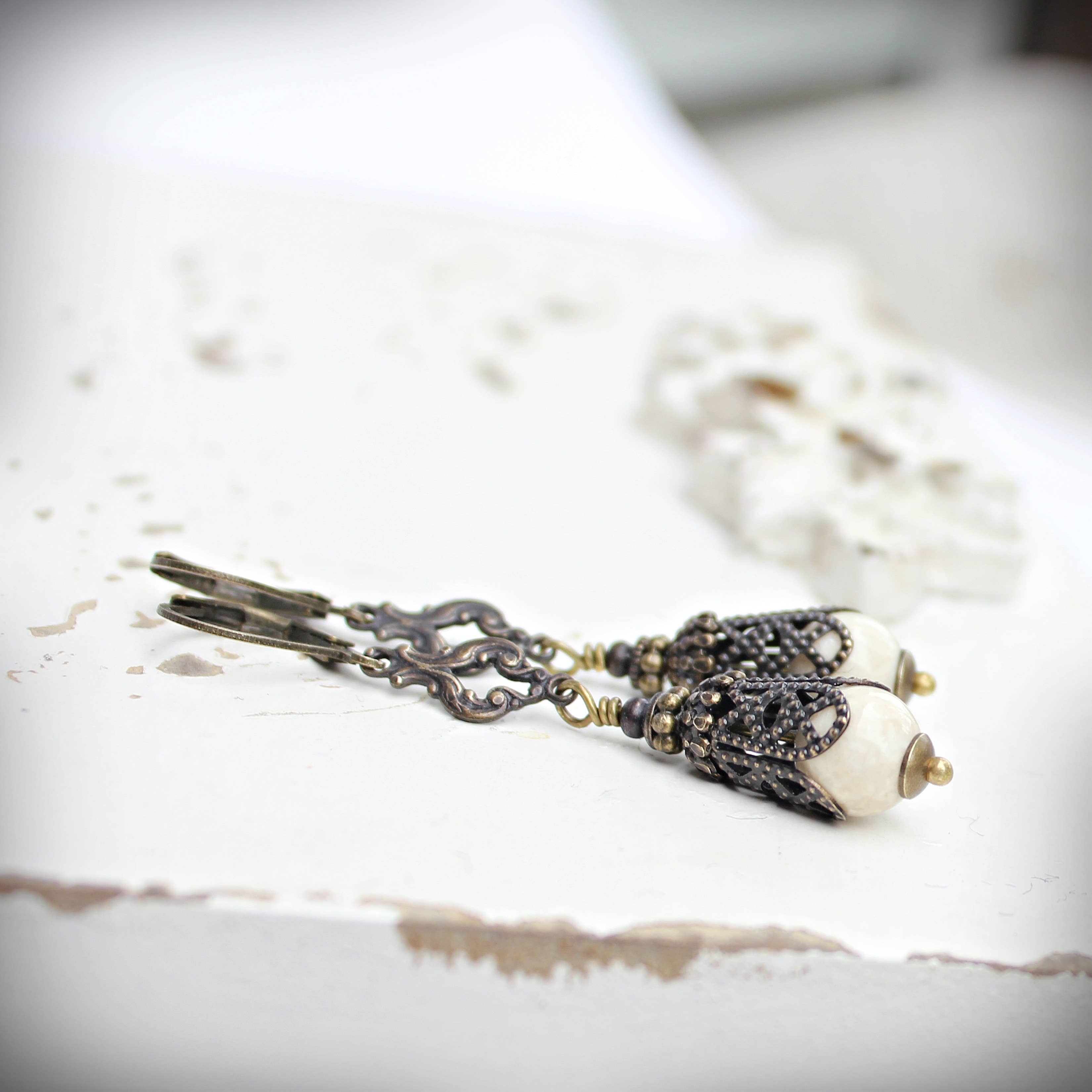 Long creamy riverstone drop earrings on antique-gold filigree – Circa 1890