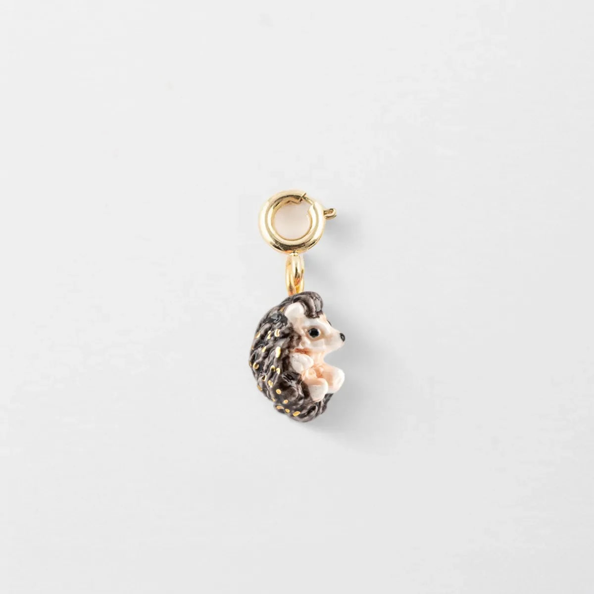 Hedgehog-shaped charm on a white background