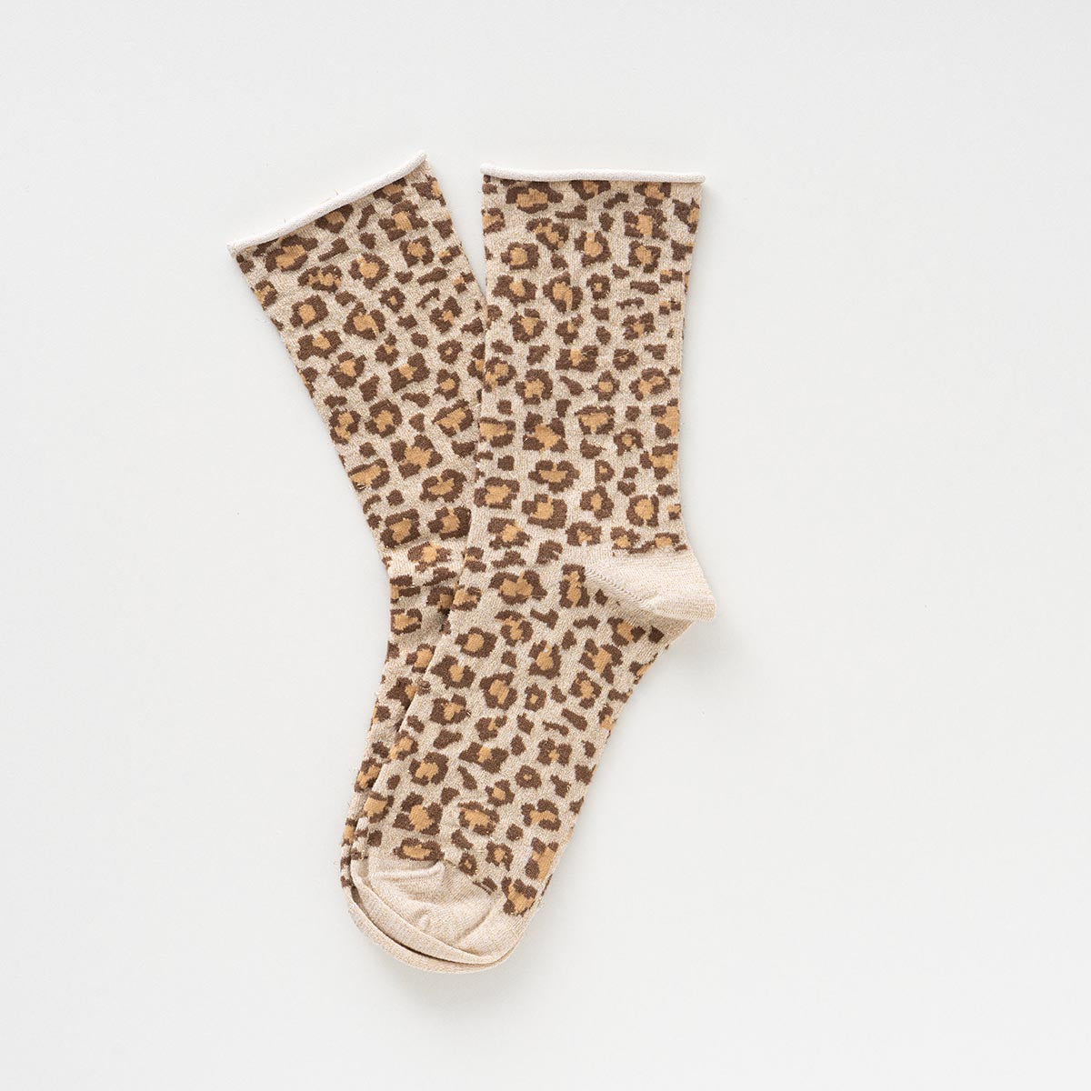 Cream and caramel leopard-print socks with glitter, laid flat to show the rolled cuffs – KLUE