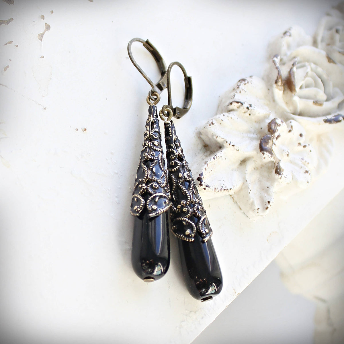 Long black onyx vintage drop earrings shown full length – Circa 1890