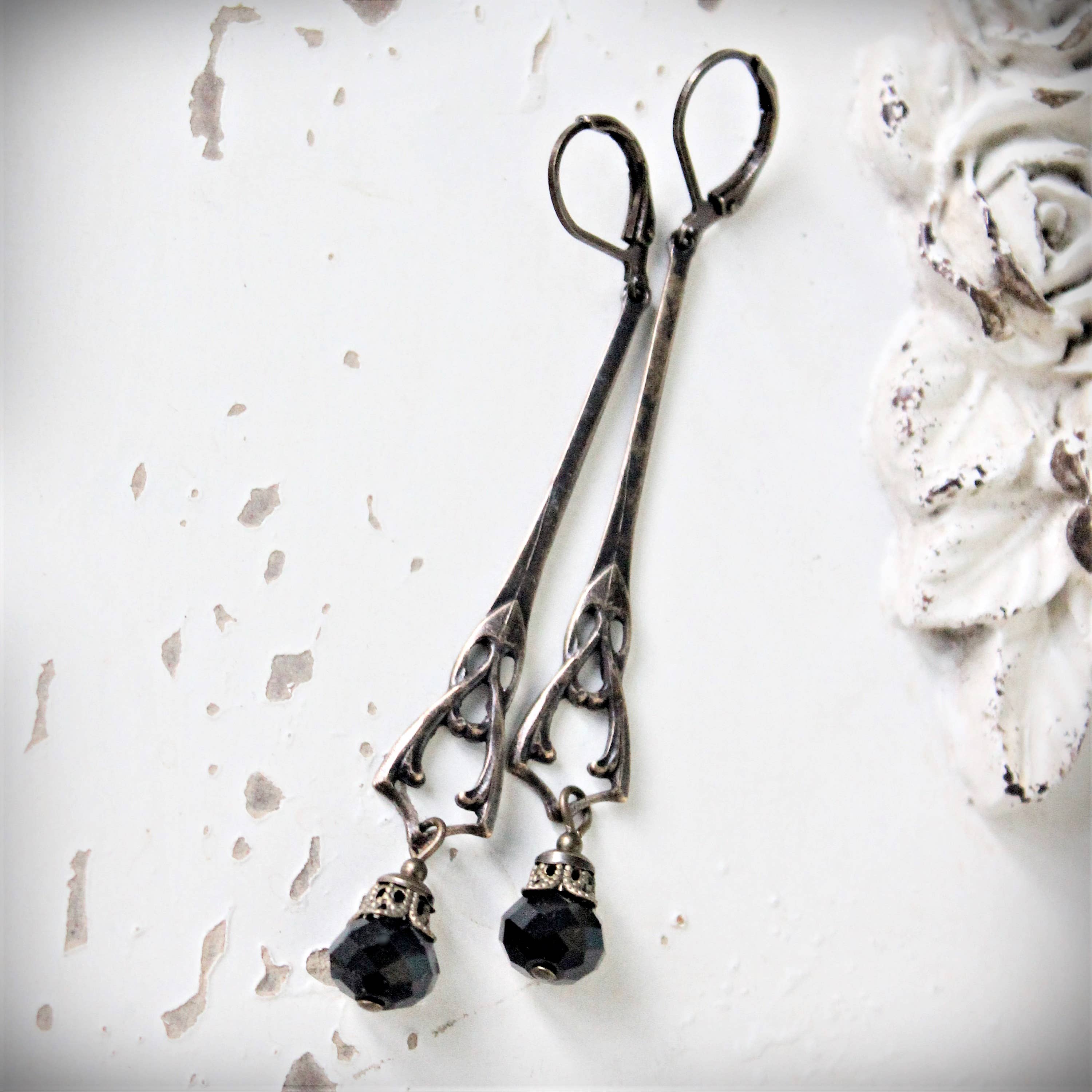 Jet-black Art Nouveau drop earrings shown full length – Circa 1890