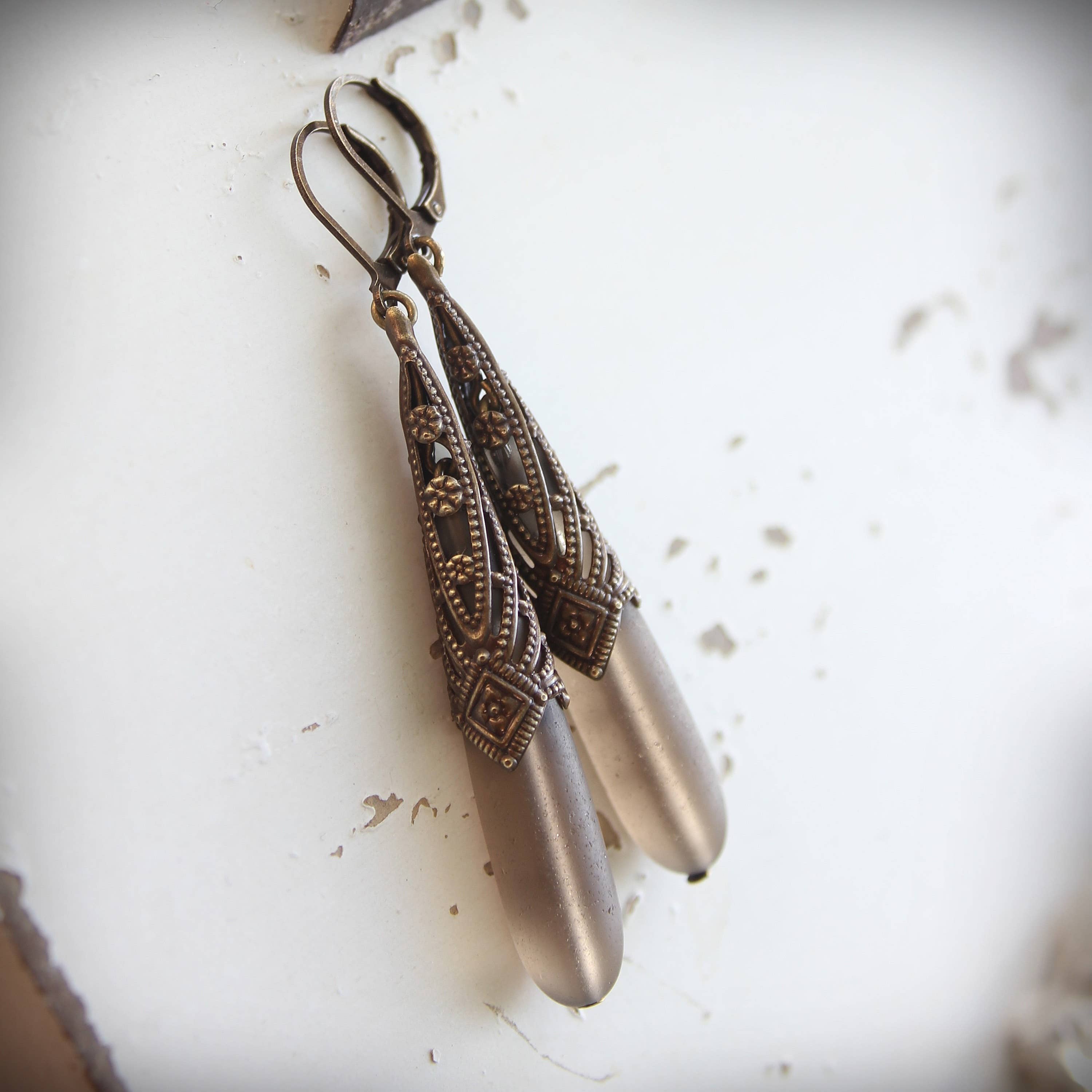 Frosted grey glass drop earrings, detail of the geometric brass – Circa 1890