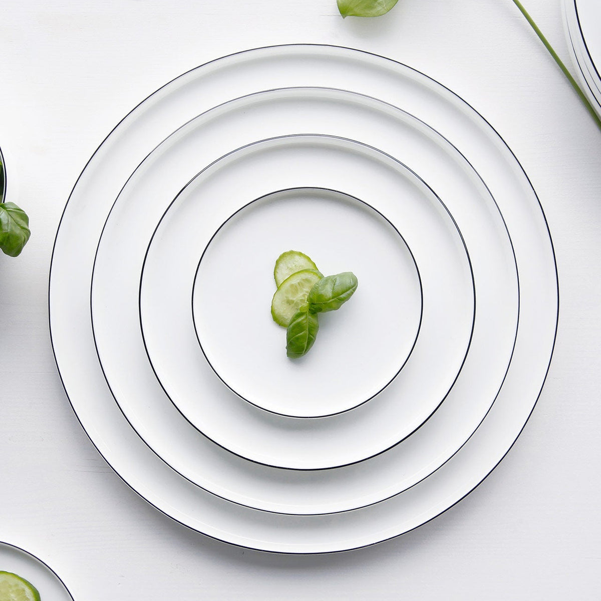OCO Ligne Noire plates nested by size on a table – ASA Selection