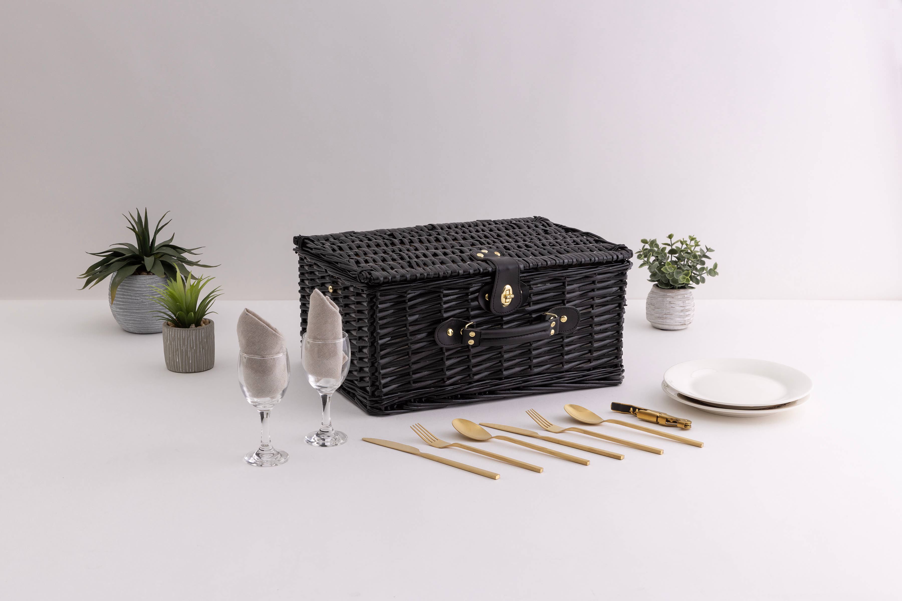 Black willow picnic basket for two styled with wine glasses and napkins - Picnic Time