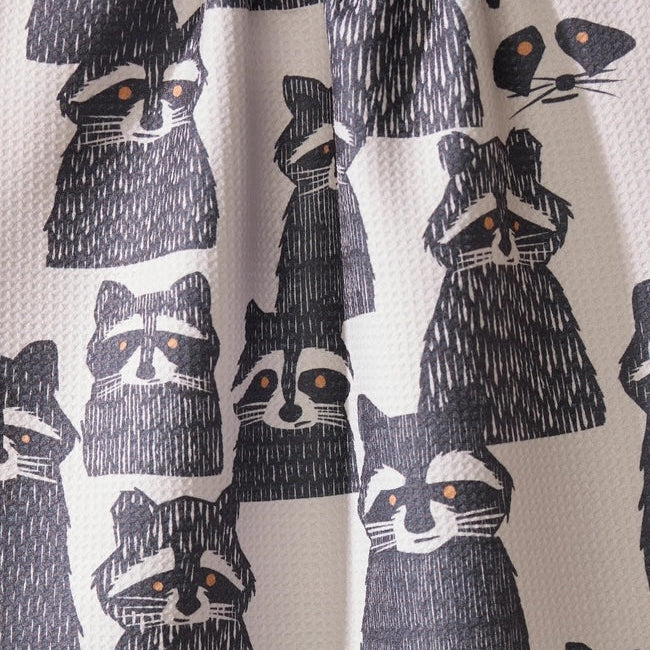 Pattern of raccoons on a fabric background