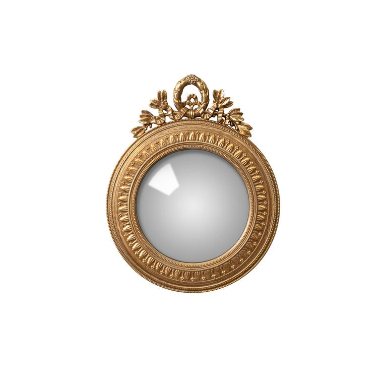 Decorative gold-framed mirror on a white background