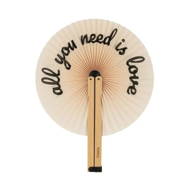 Handheld fan with 'all you need is love' text on a white background