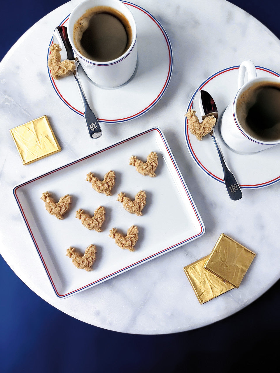 Canasuc Rooster Shaped Sugars on coffee saucers in a French cafe - Canasuc