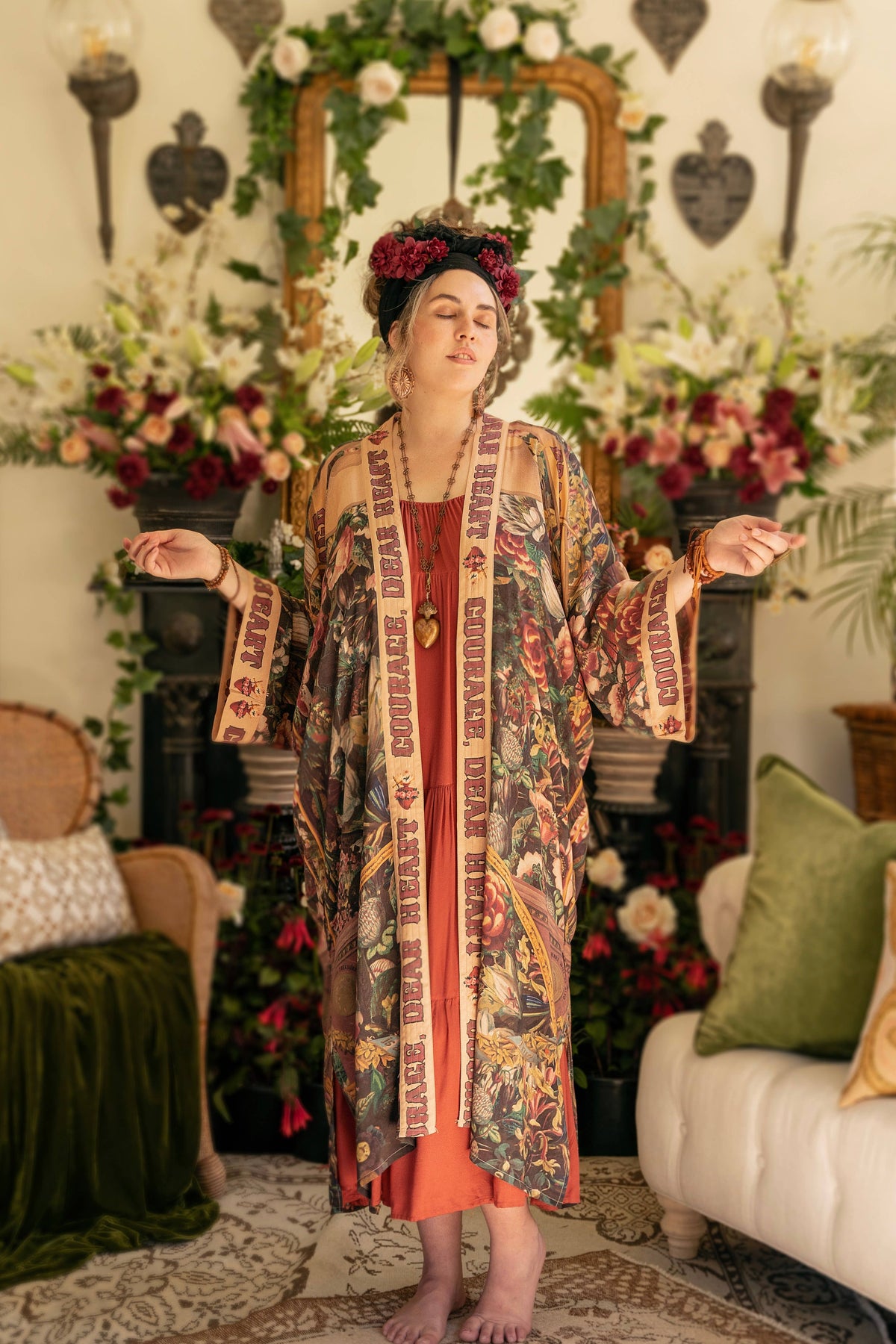 Woman in a botanical print kimono with Courage Dear Heart lettered trim over a rust dress – Market of Stars