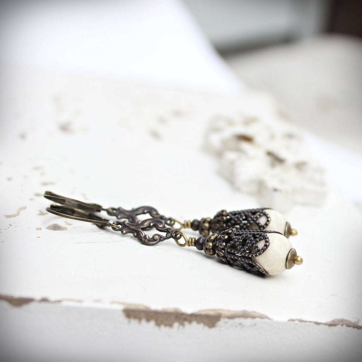 Long riverstone vintage-style earrings shown full length – Circa 1890