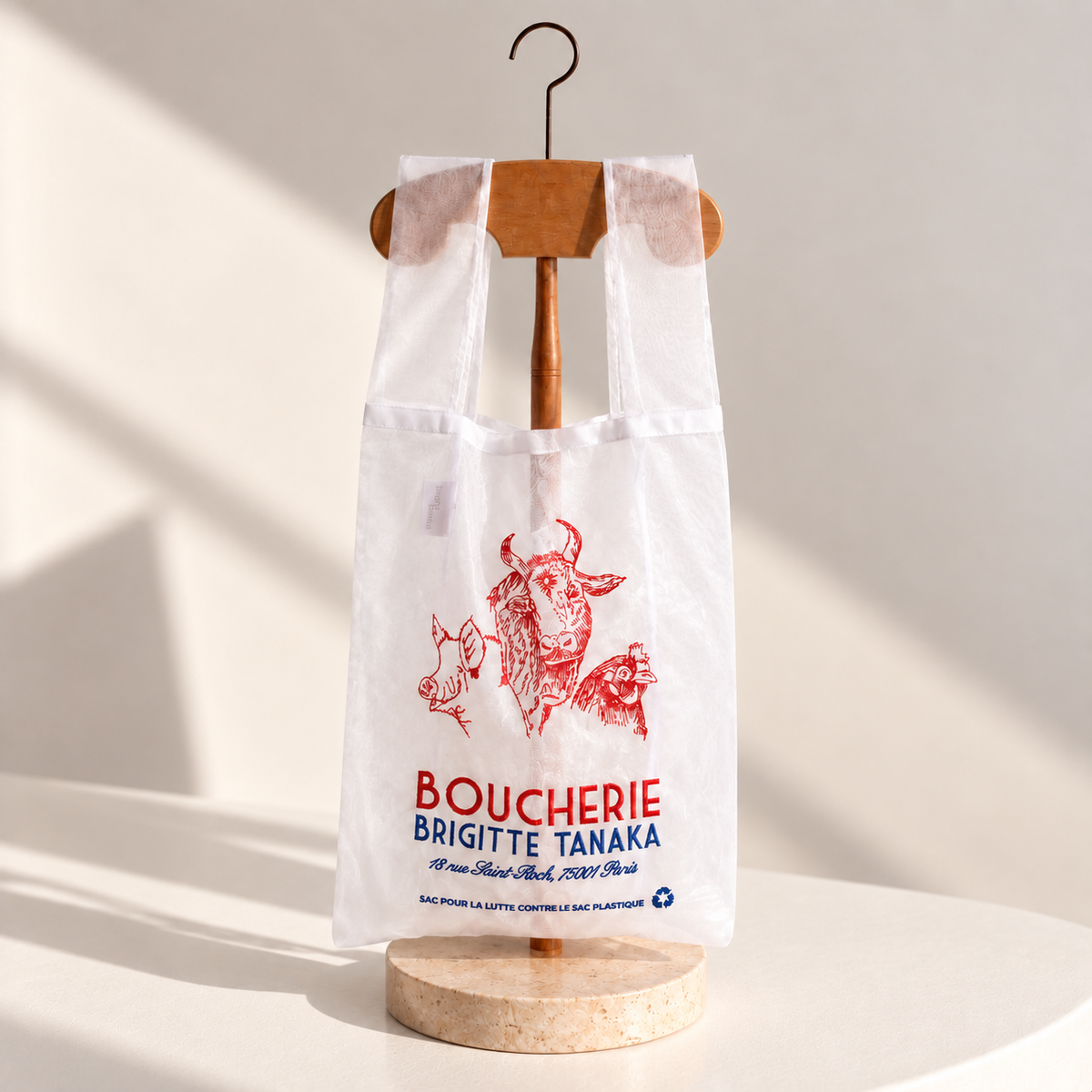 Organza shop bag embroidered in red with a cow, pig and Boucherie lettering – Brigitte Tanaka