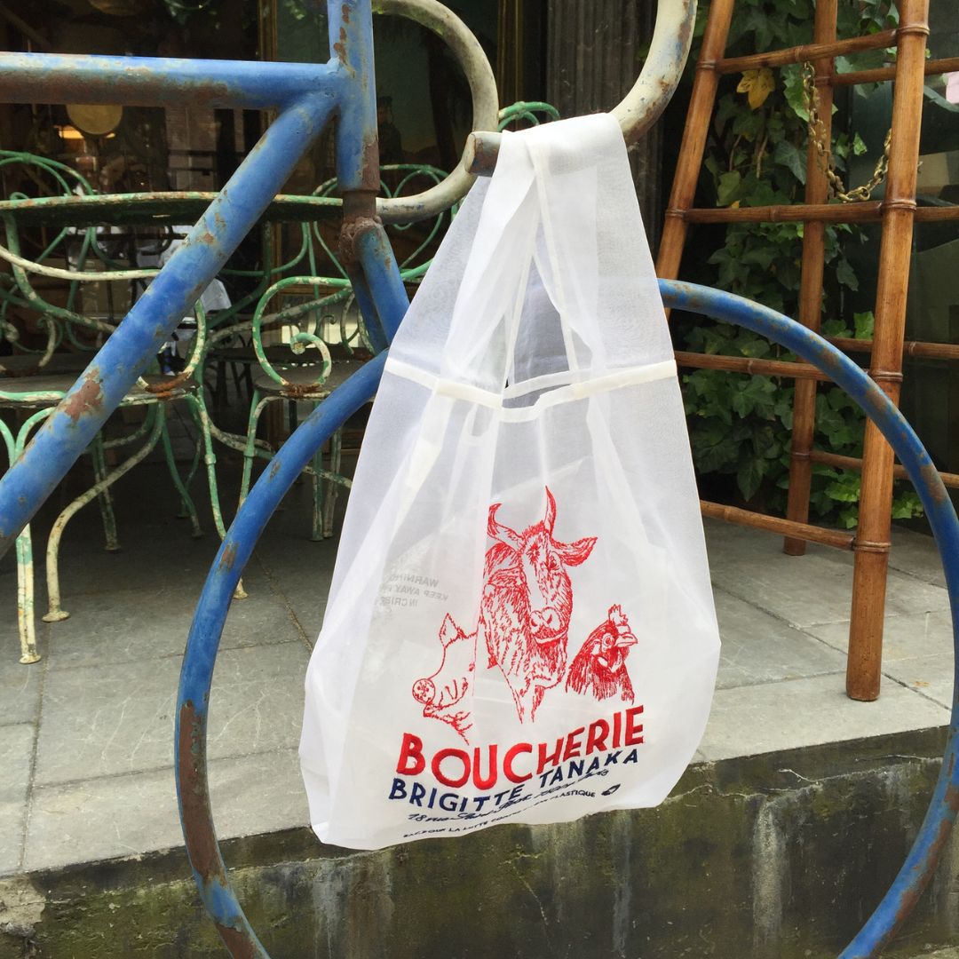 Boucherie organza bag hanging from a blue vintage bicycle – Brigitte Tanaka