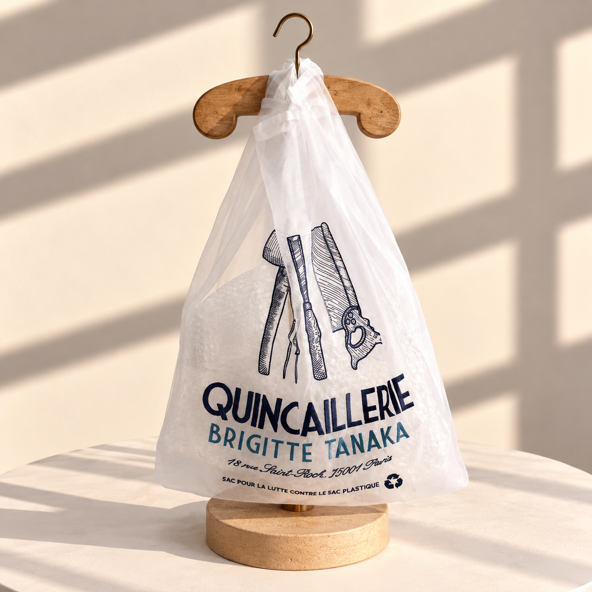 Large organza bag embroidered in navy with vintage hand tools and Quincaillerie lettering – Brigitte Tanaka