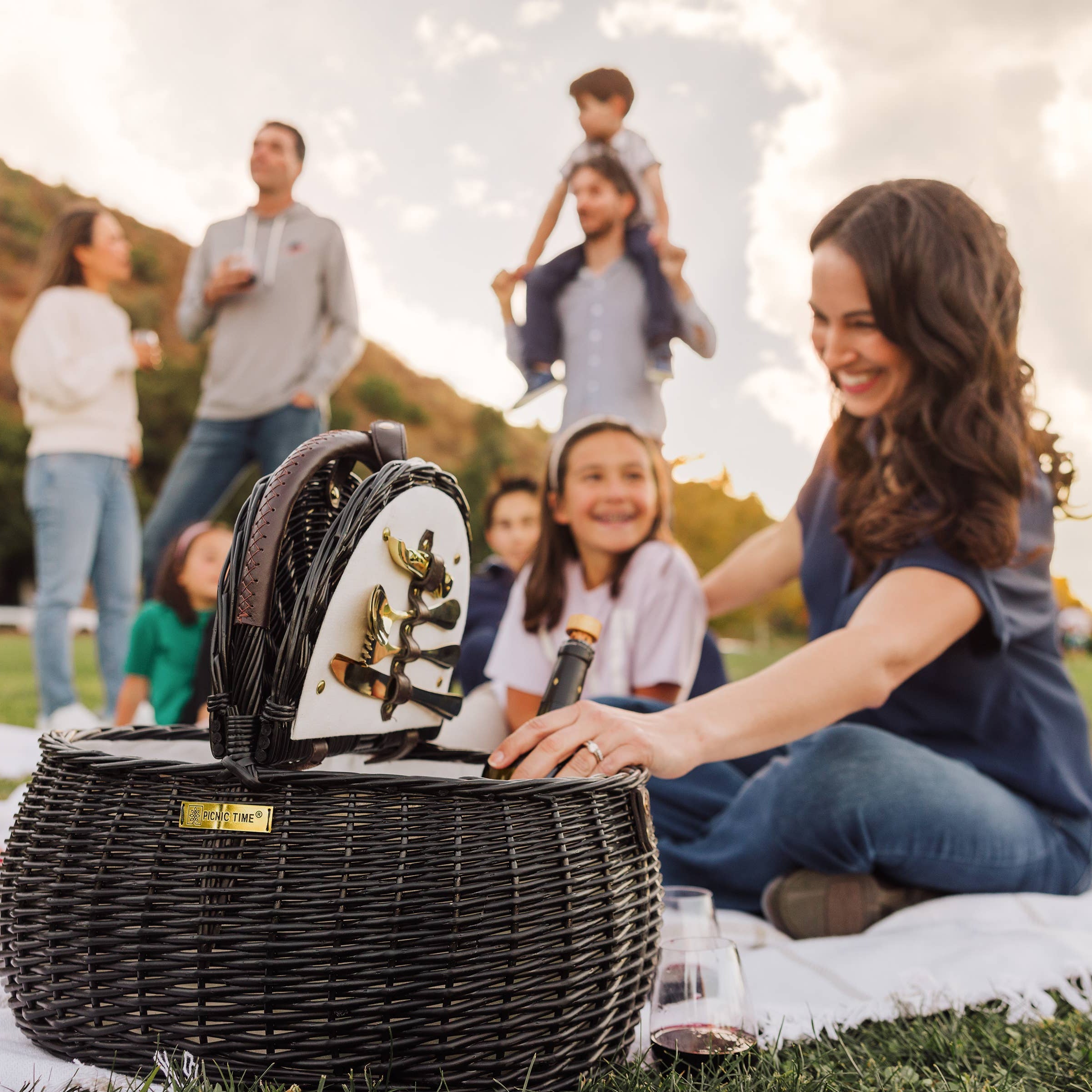 Evening Picnic Basket at a family picnic in the park at golden hour - Picnic Time