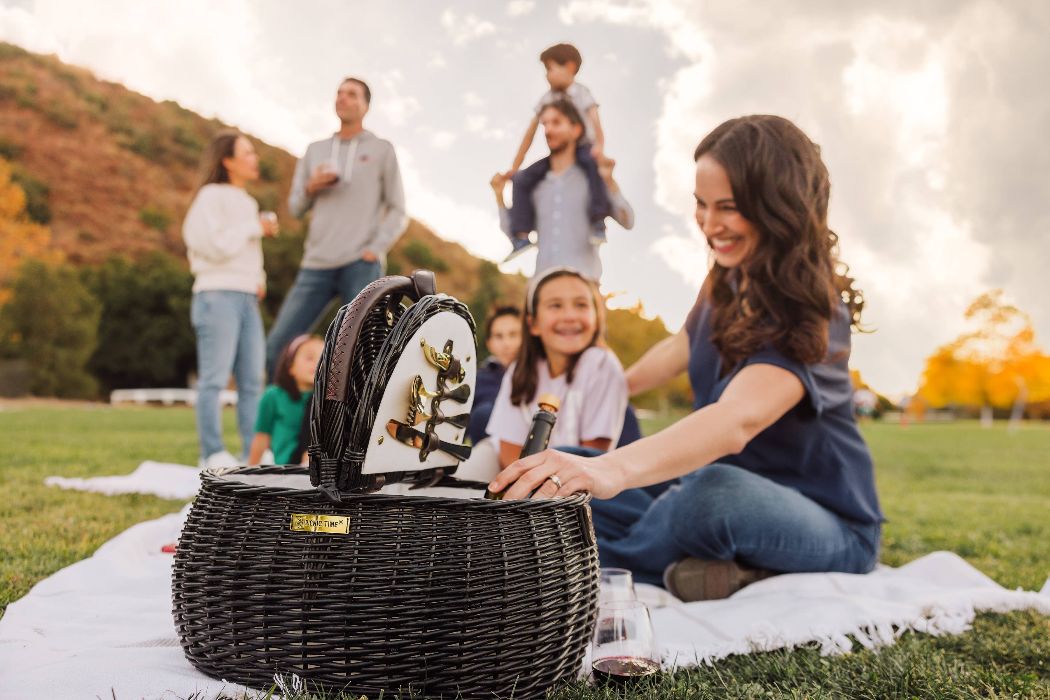 Evening Picnic Basket at a family picnic in the park at golden hour - Picnic Time