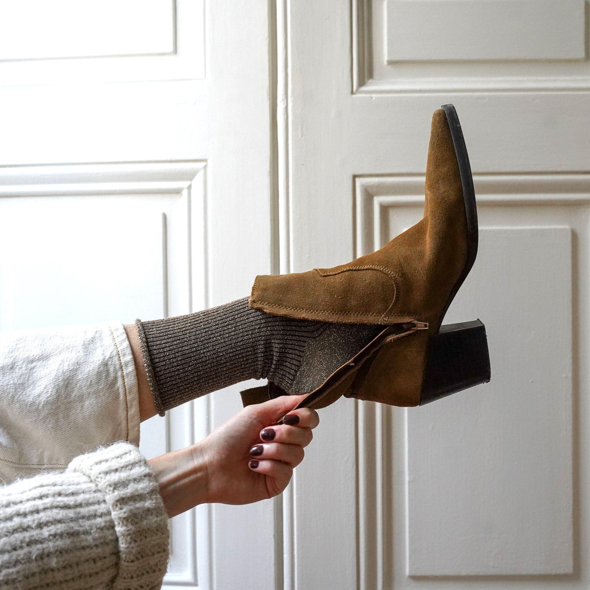 Caramel glitter sock slipping into a suede ankle boot – KLUE