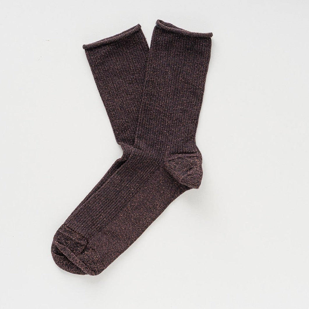 Dark chocolate brown socks with a subtle shimmer, laid flat to show the rolled cuffs – KLUE