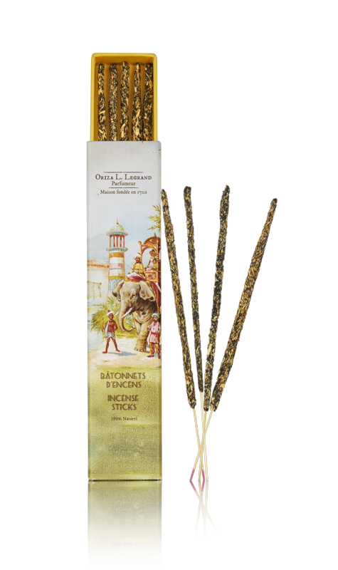 Tall illustrated Belle Époque box beside hand-rolled resin incense sticks – Oriza L. Legrand