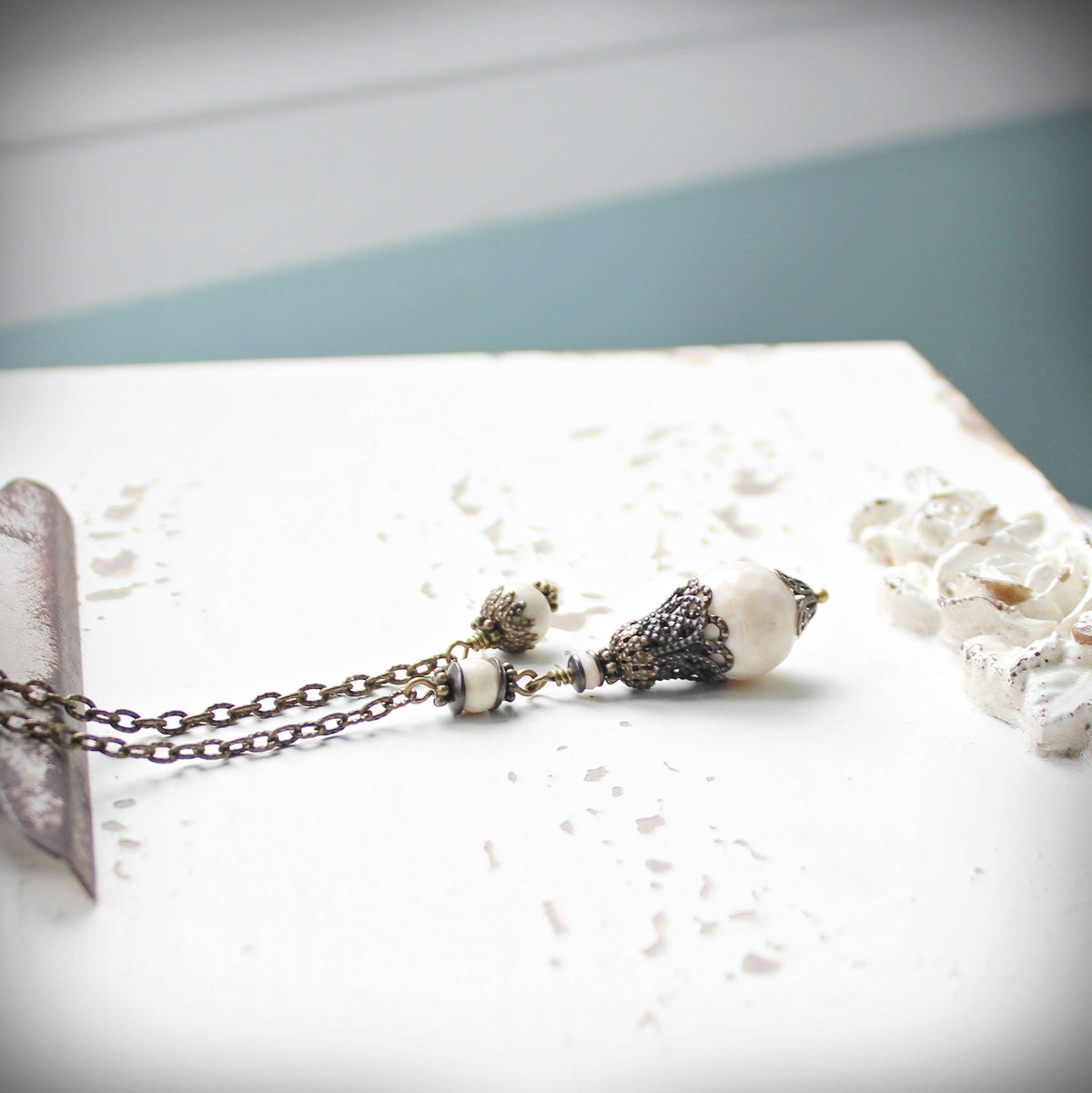 Petrified wood pendulum with brass cap and bead detail – Circa 1890