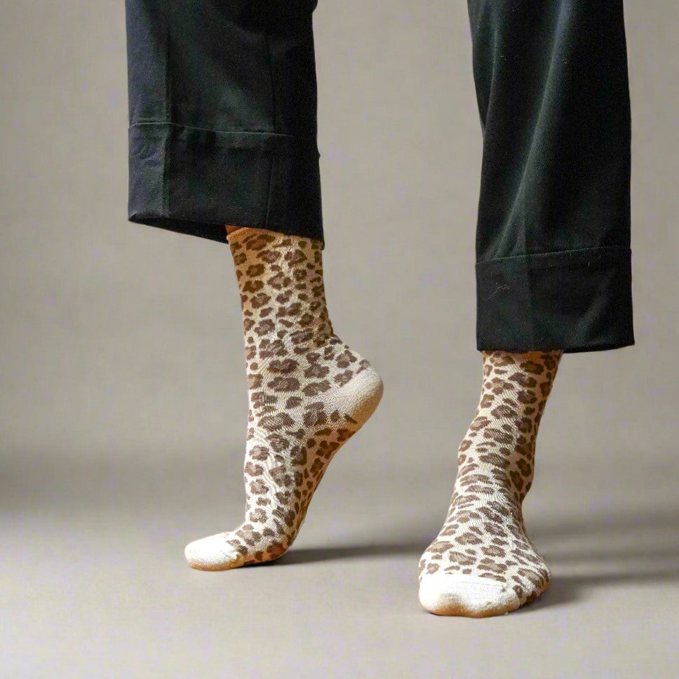 Beige leopard glitter socks worn under cropped black trousers – KLUE