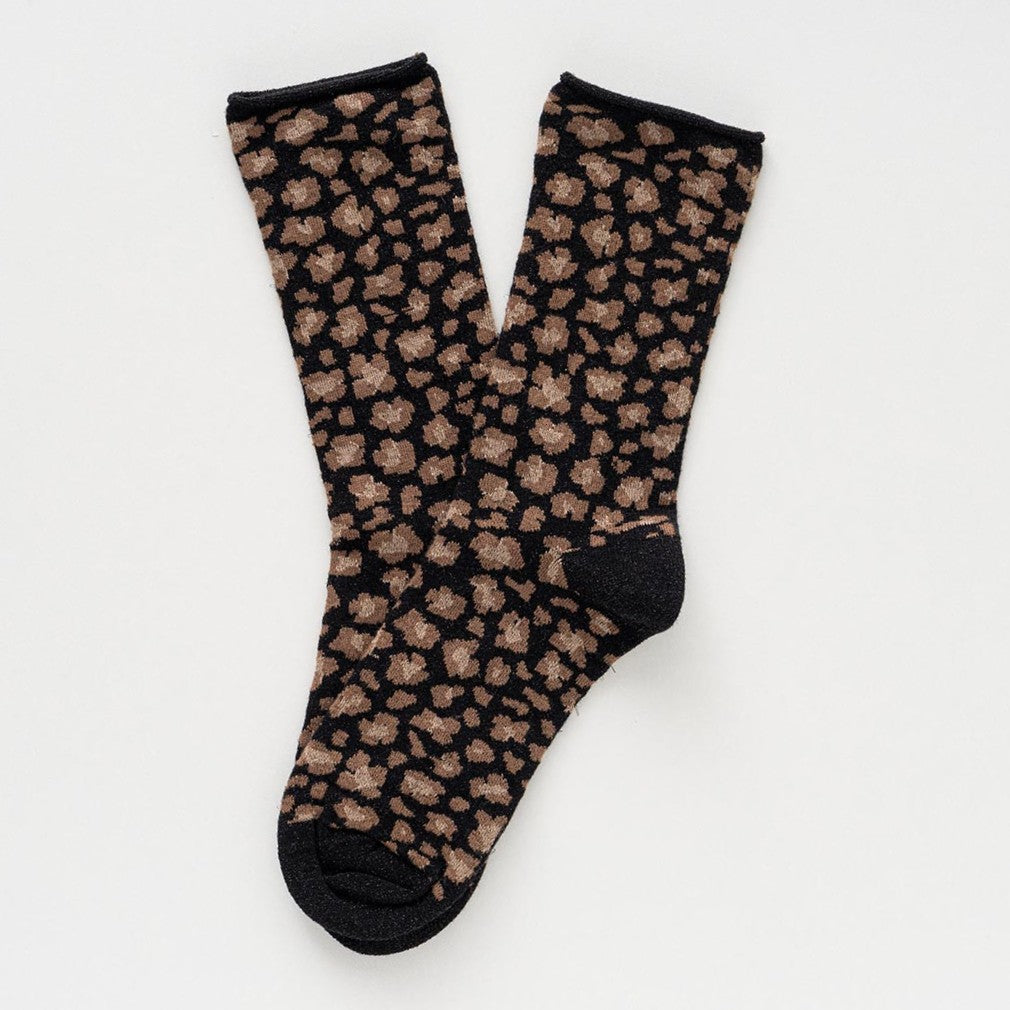 Black and camel leopard-print socks with glitter, laid flat to show the rolled cuffs – KLUE