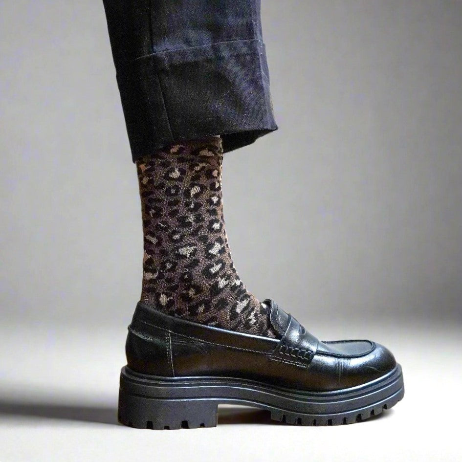 Brown leopard glitter socks paired with black lug-sole loafers – KLUE
