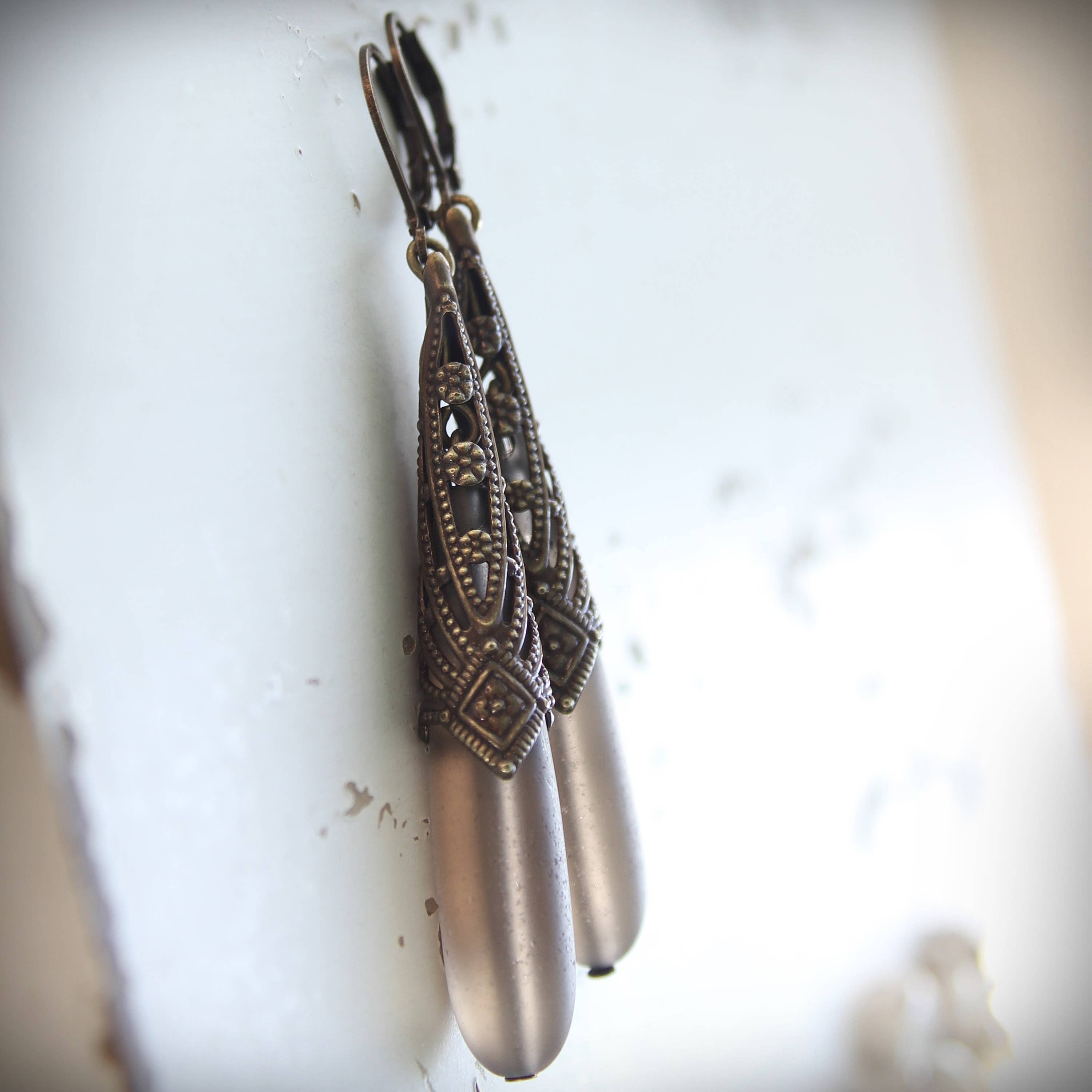 Long frosted smoky-grey glass drop earrings in an Art Deco brass setting – Circa 1890