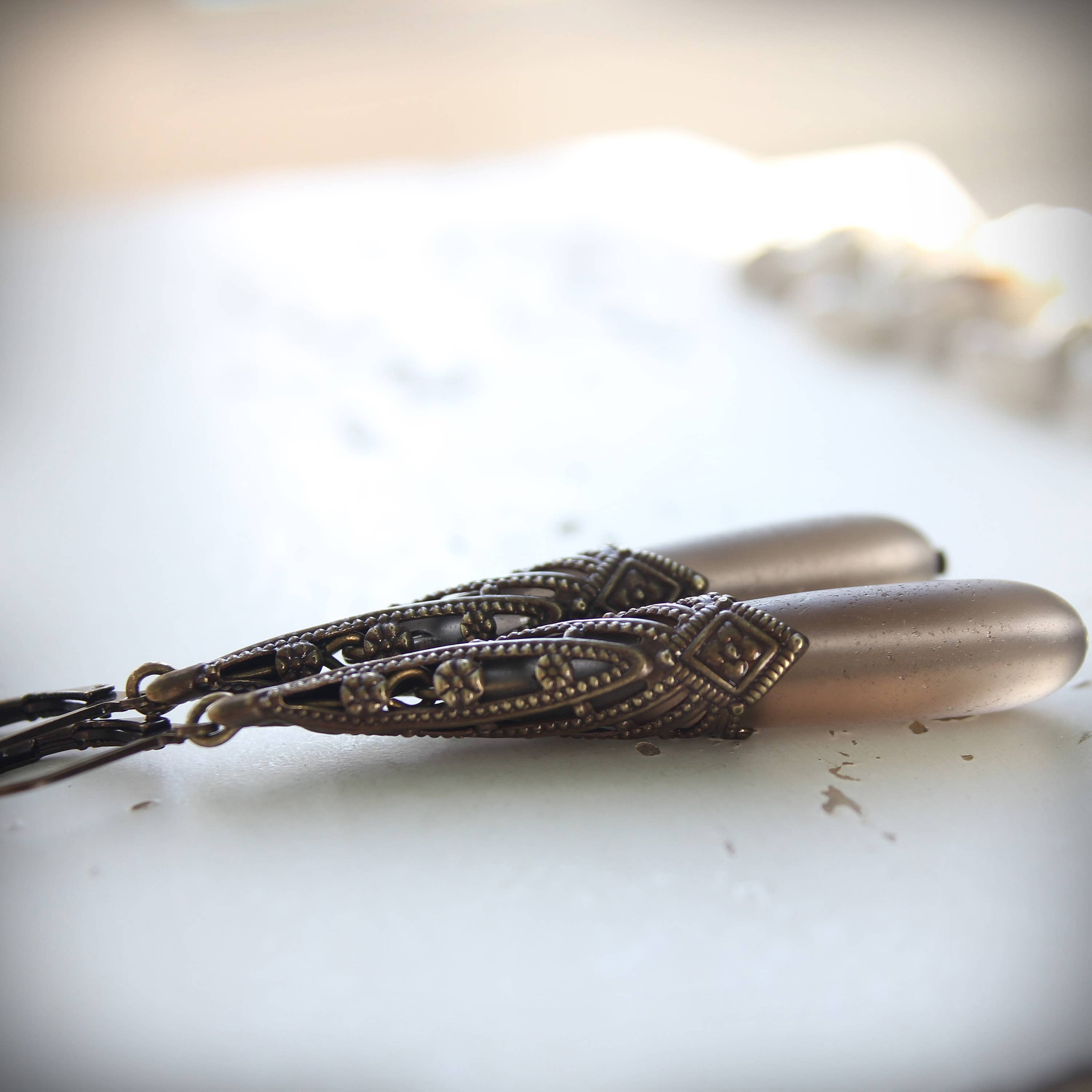 Smoky frosted glass Art Deco drops, close view – Circa 1890