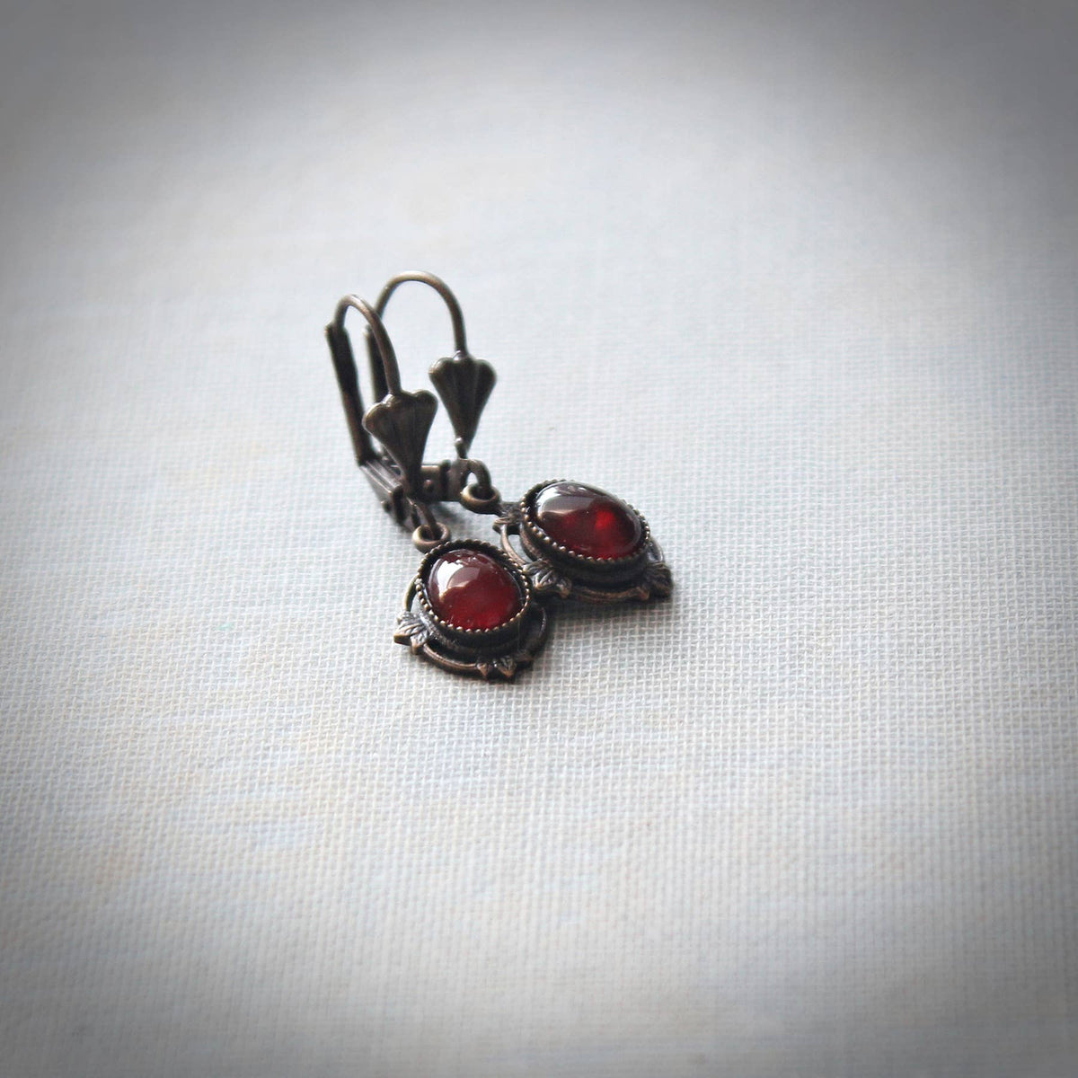 Petite carnelian drop earrings with red cabochons in antique-gold brass – Circa 1890