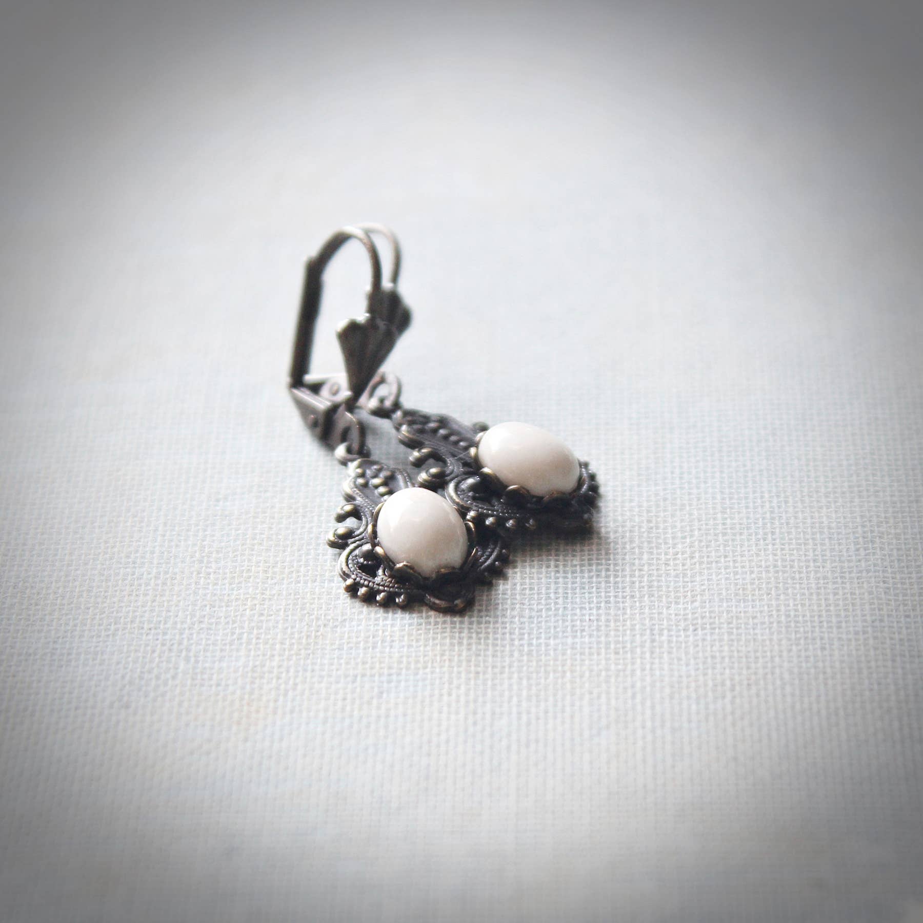 Creamy riverstone Victorian drop earrings in openwork antique-gold brass – Circa 1890