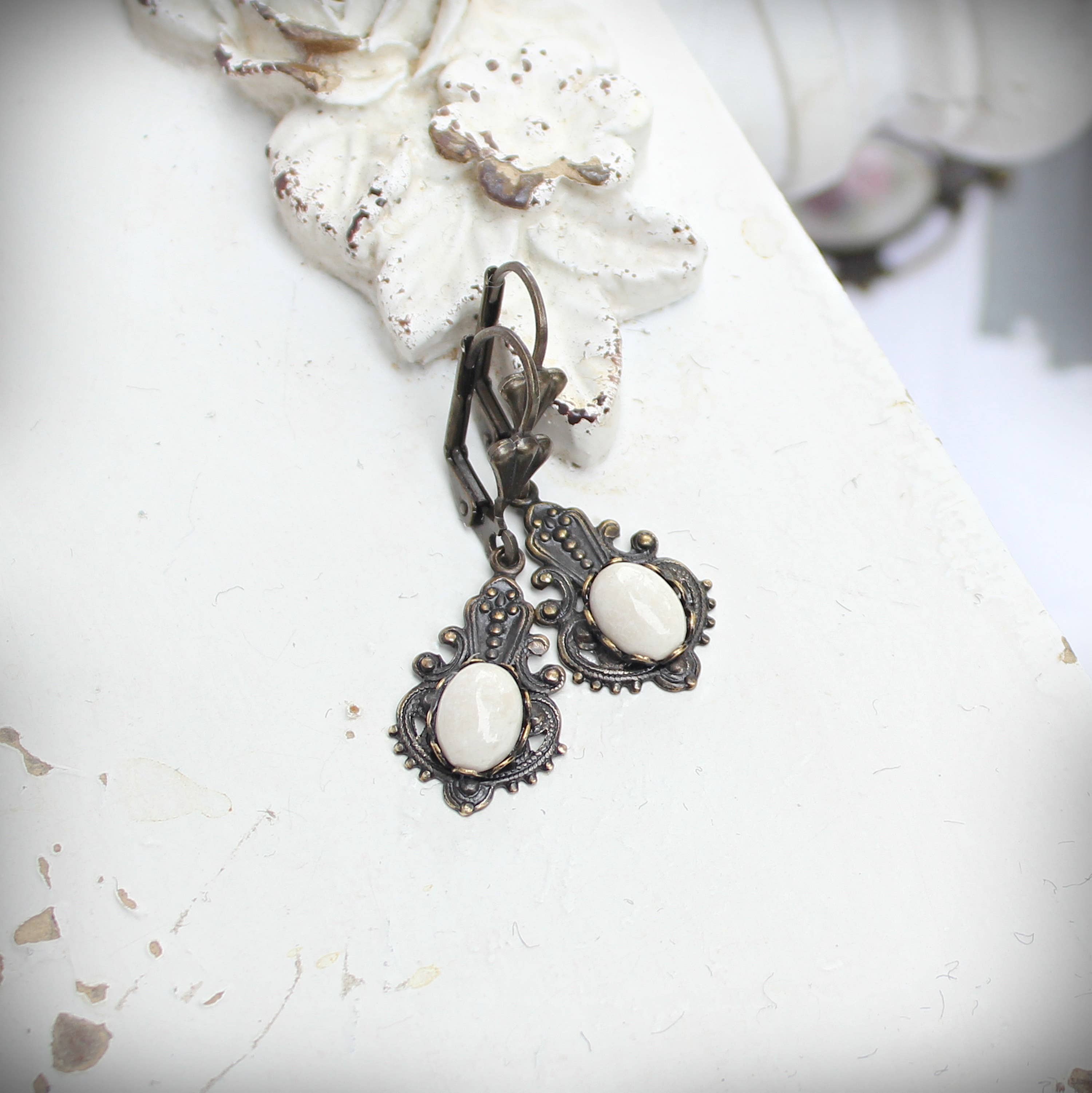 Pair of riverstone Victorian drop earrings shown together – Circa 1890