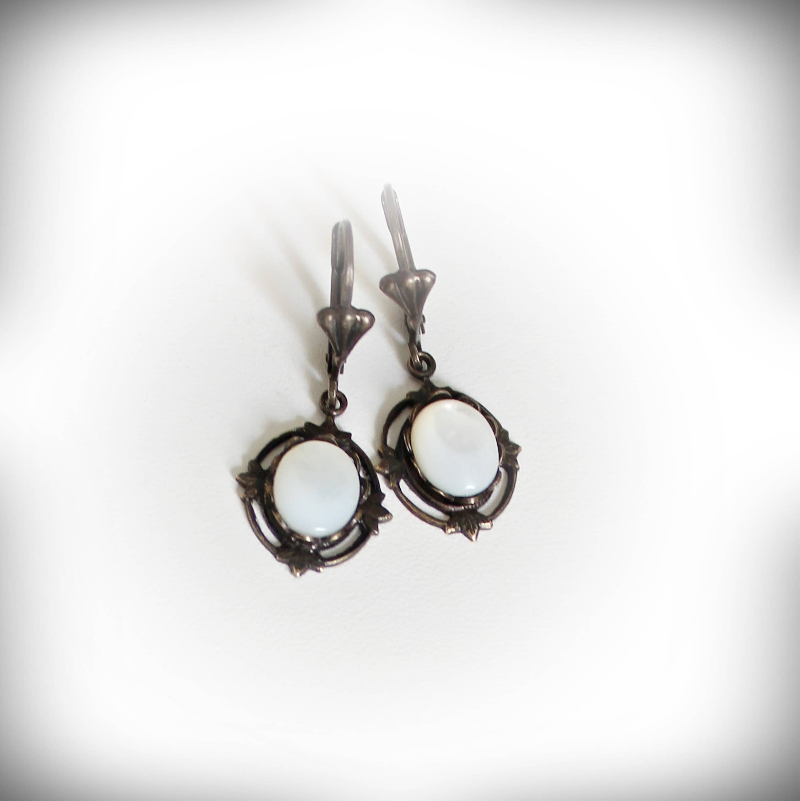 Creamy riverstone Victorian drop earrings, close view – Circa 1890