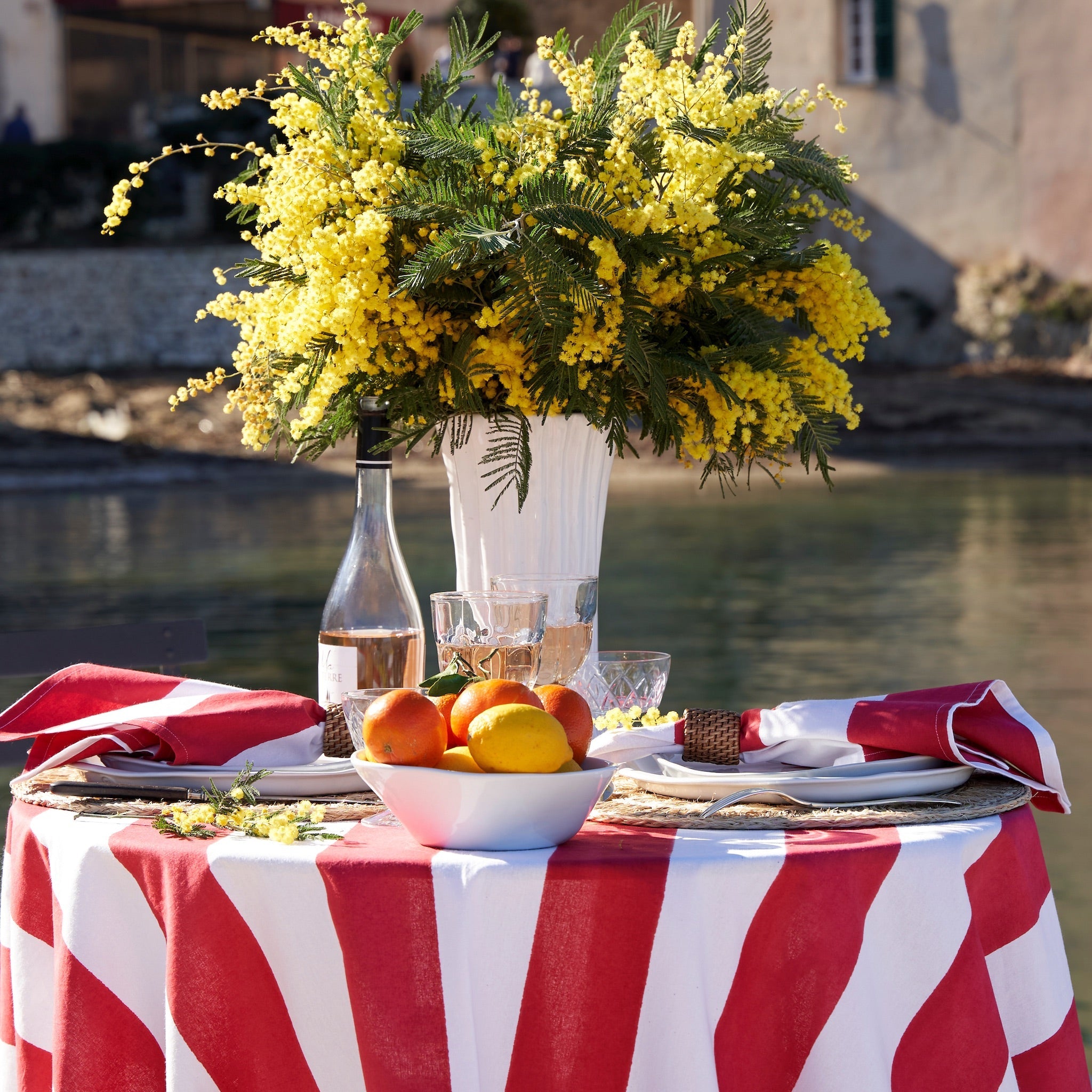 St. Tropez Red Stripes table setting with mimosa and citrus – Caravan Home