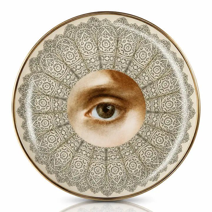 Round porcelain dish with a painted brown eye framed by grey lace-like pattern and gold rim – Spitfire Girl