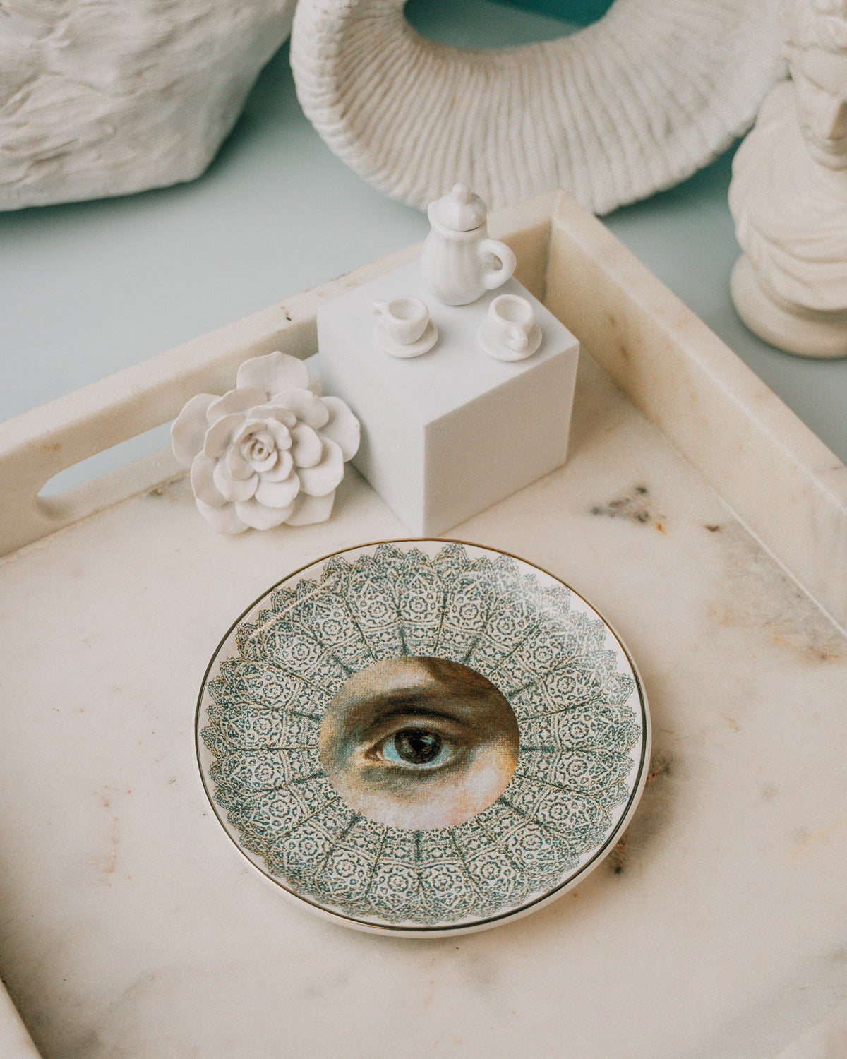 Porcelain eye dish with lace-like grey pattern on a white tray beside ceramic decor – Spitfire Girl