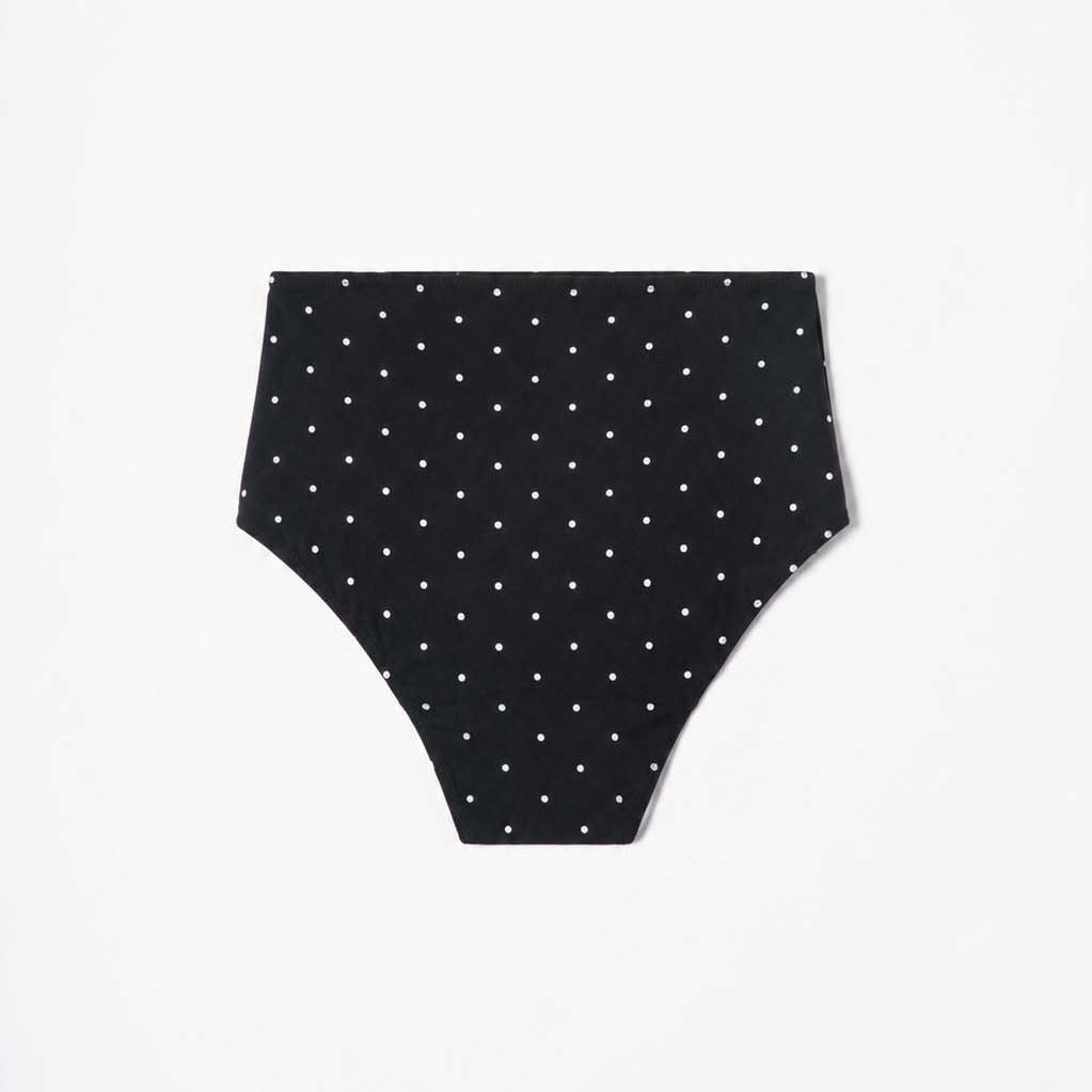 Mini-dot high-waist bikini worn by the water, sculpted waistband in view – Blanche Edit