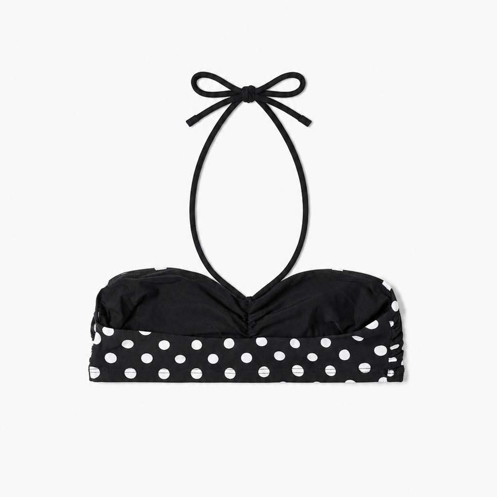 Polka-dot bandeau bikini top styled on the beach, side view – Blanche Edit